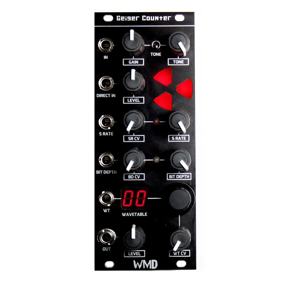 Geiger Counter Eurorack module front panel: a tall black panel topped with the Geiger Counter name, a red radiation-hazard symbol in the upper middle, six jacks down the left edge labeled IN, DIRECT IN, S RATE, BIT DEPTH, WT and OUT, knobs for GAIN, TONE, LEVEL, SR CV, S RATE, BD CV and BIT DEPTH, a two-digit red WAVETABLE display with a push-mode encoder, and LEVEL and WT CV knobs at the bottom above the WMD logo.